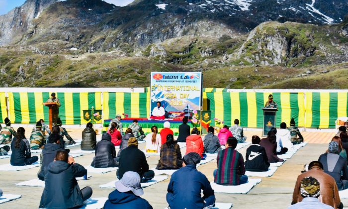 Troops of India and China perform Yoga in Nathu La and Bum La