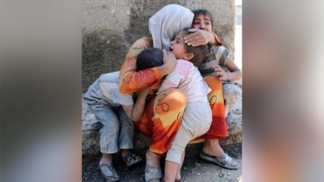 Fact Check: Viral picture of woman hugging crying kids is not from India