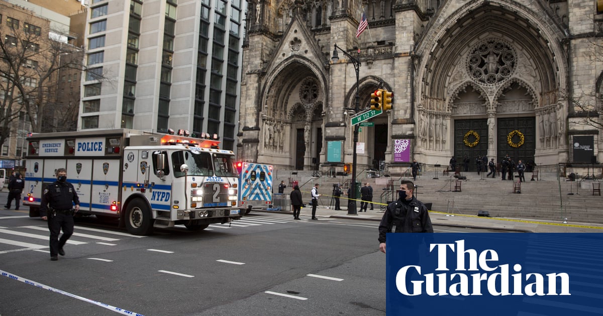 New York police shoot gunman who opened fire outside cathedral Christmas concert